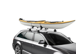 Kayaks slide on  using the DockGlide rear felt lined pad then secured with Thule Straps